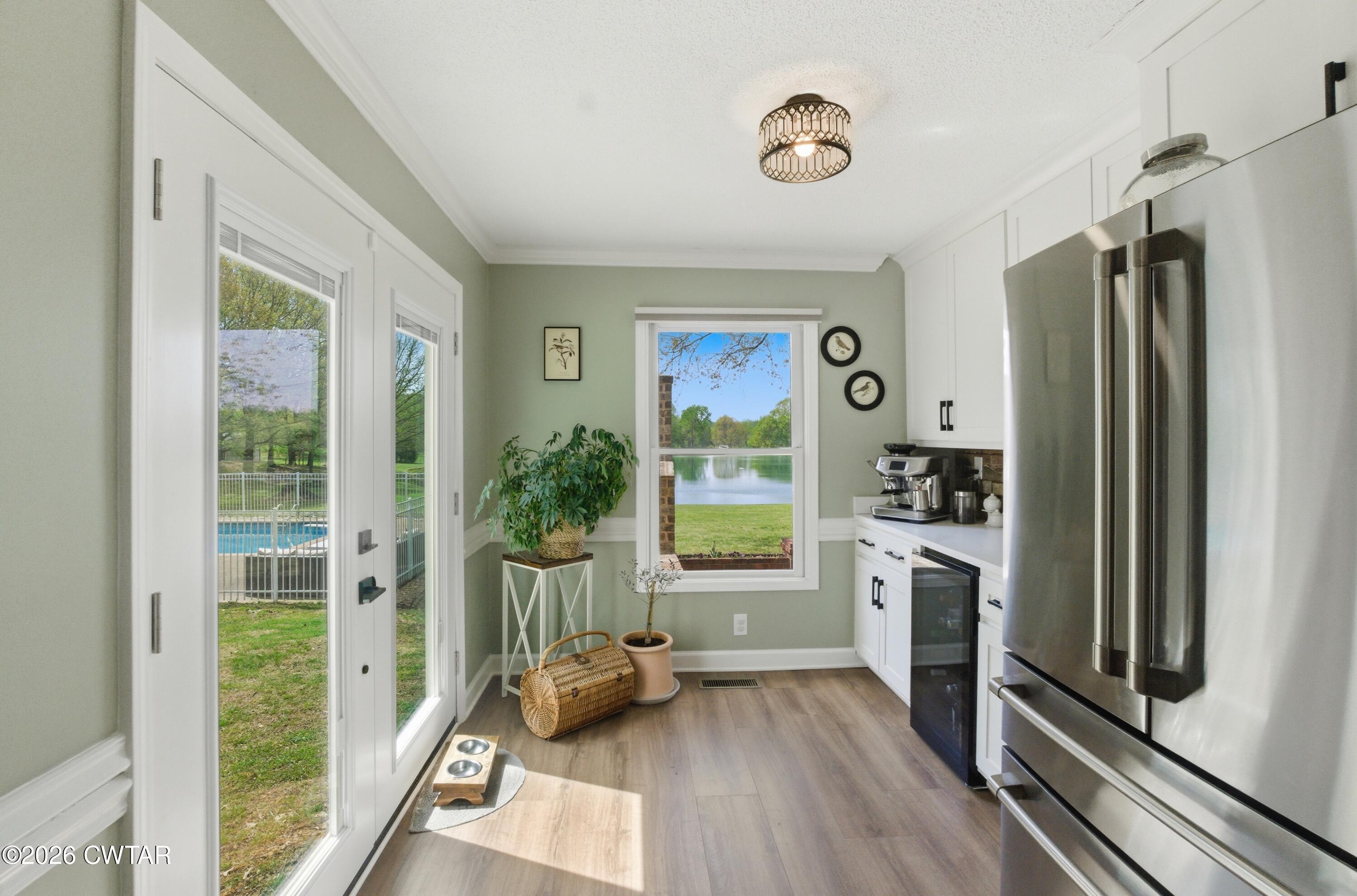 2757 Edward Williams Road Gadsden, TN 38337 - Photo 29 of 51 a kitchen with a refrigerator a stove top oven a sink and a large window