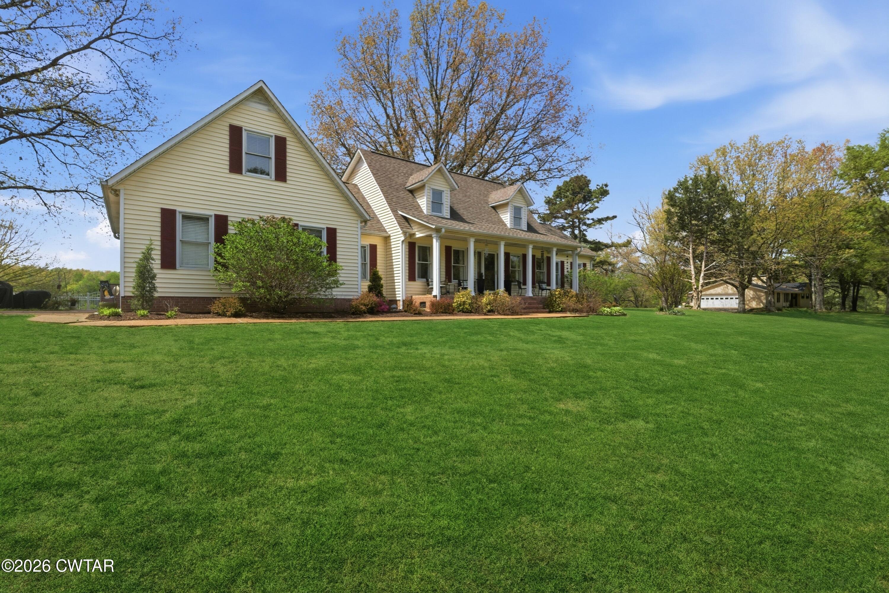 2757 Edward Williams Road Gadsden, TN 38337 - Photo 3 of 51 a front view of a house with a yard