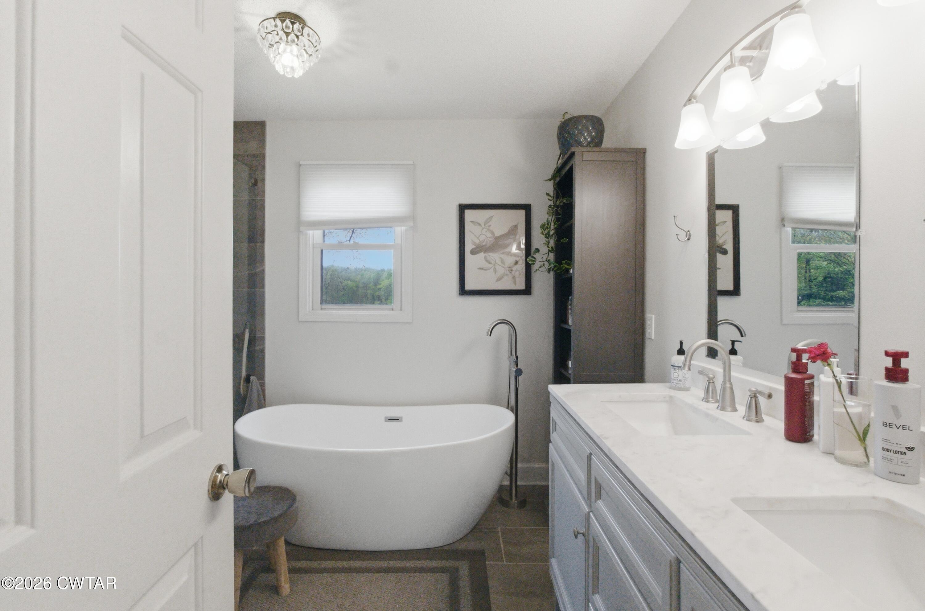 2757 Edward Williams Road Gadsden, TN 38337 - Photo 36 of 51 a bathroom with a sink and a mirror