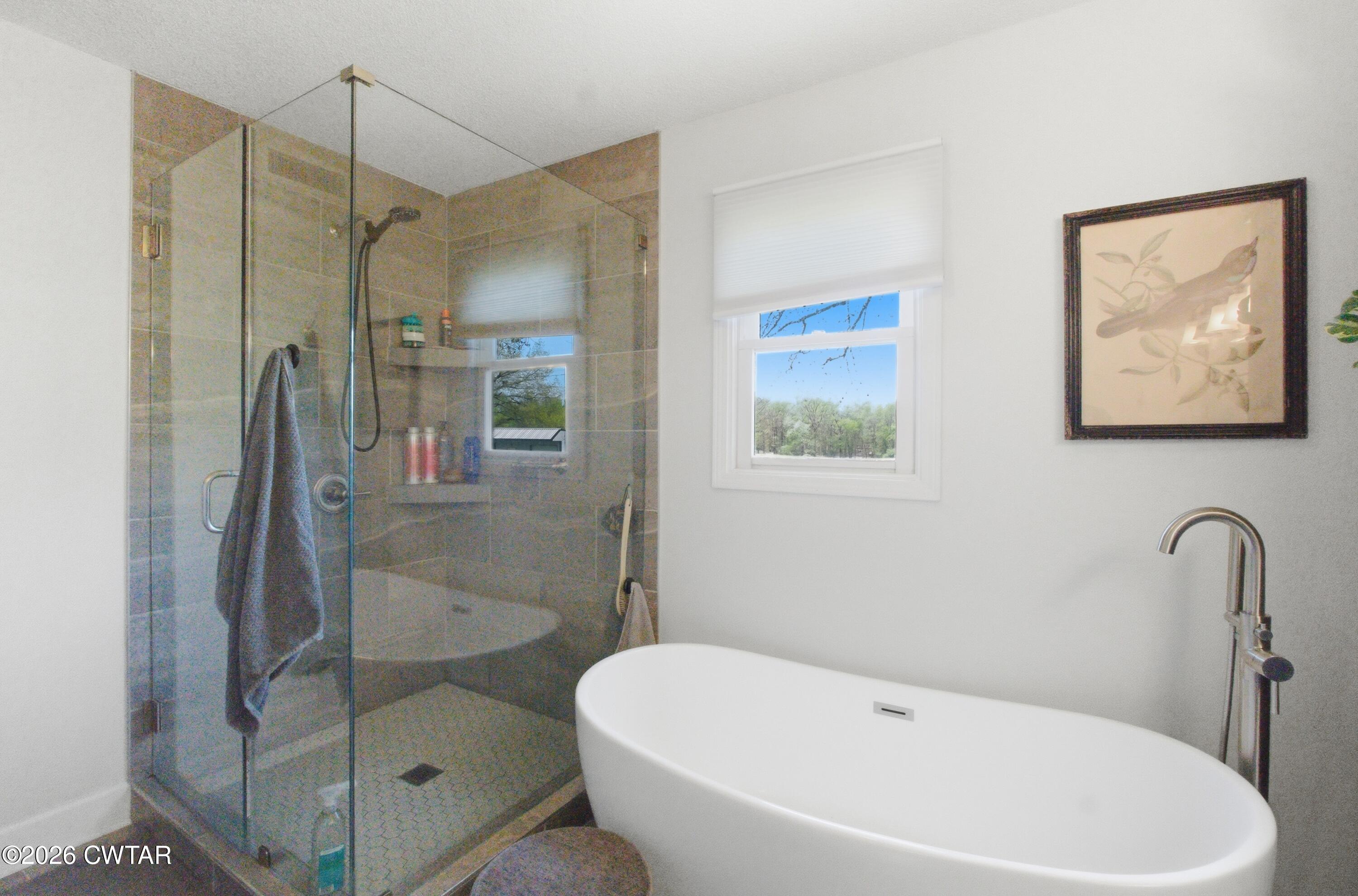 2757 Edward Williams Road Gadsden, TN 38337 - Photo 37 of 51 a bathroom with a bathtub and a shower