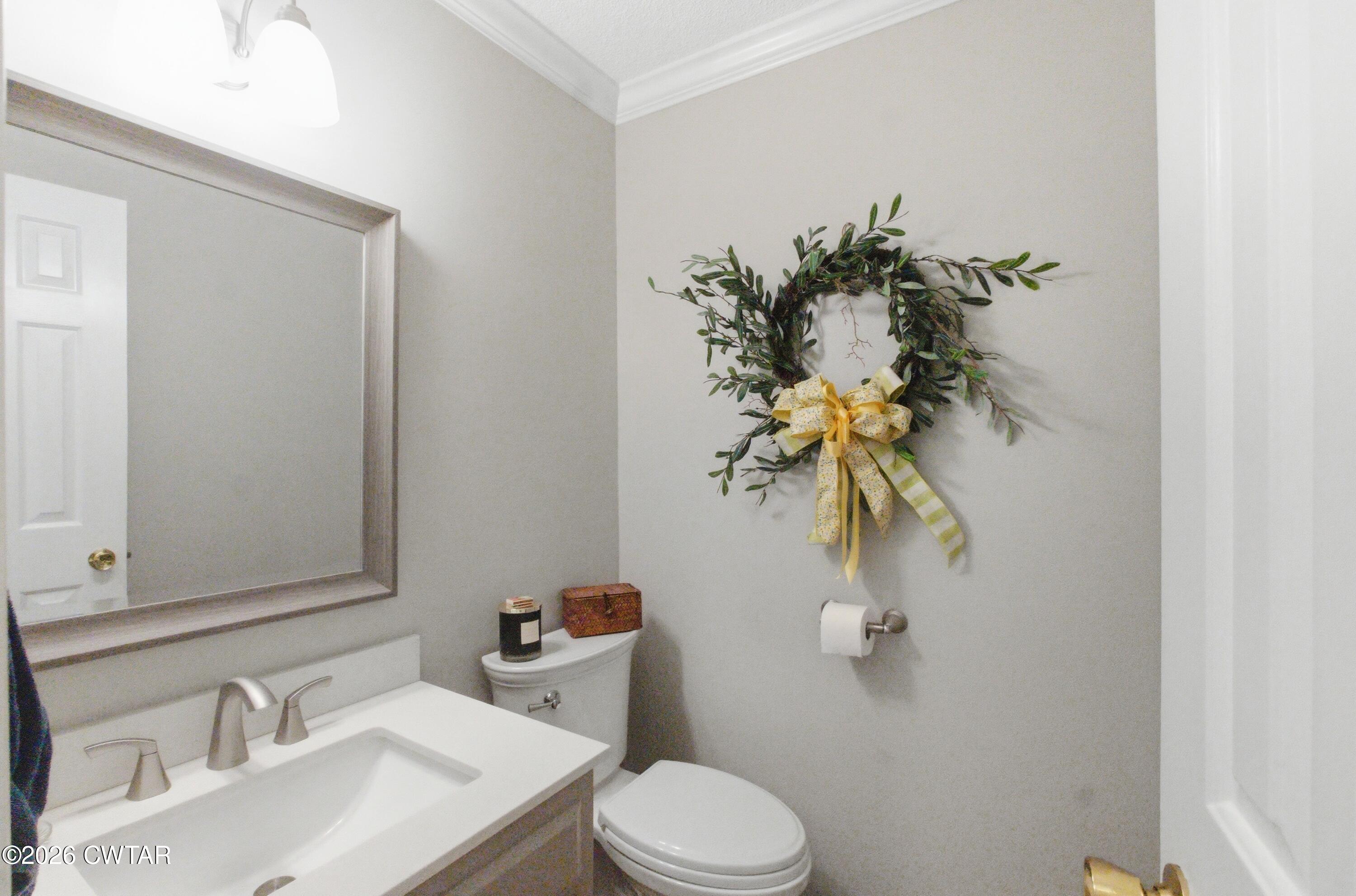 2757 Edward Williams Road Gadsden, TN 38337 - Photo 41 of 51 a bathroom with a toilet sink and mirror