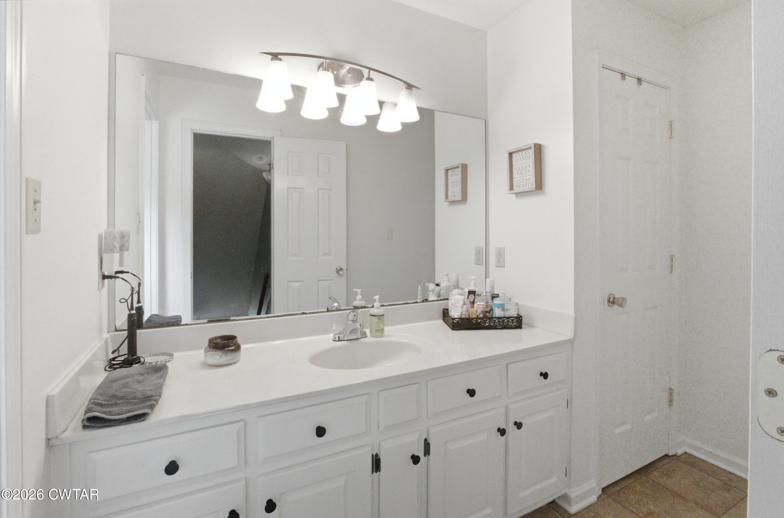 2757 Edward Williams Road Gadsden, TN 38337 - Photo 43 of 51 a bathroom with a sink vanity and a mirror