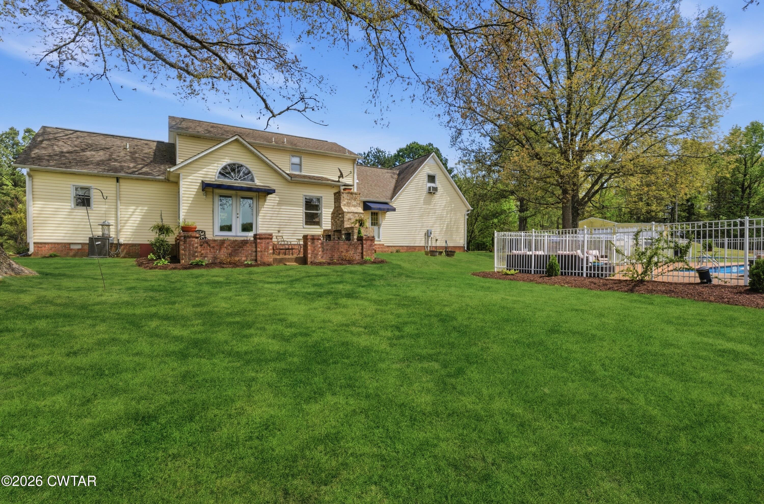 2757 Edward Williams Road Gadsden, TN 38337 - Photo 44 of 51 a front view of a house with garden