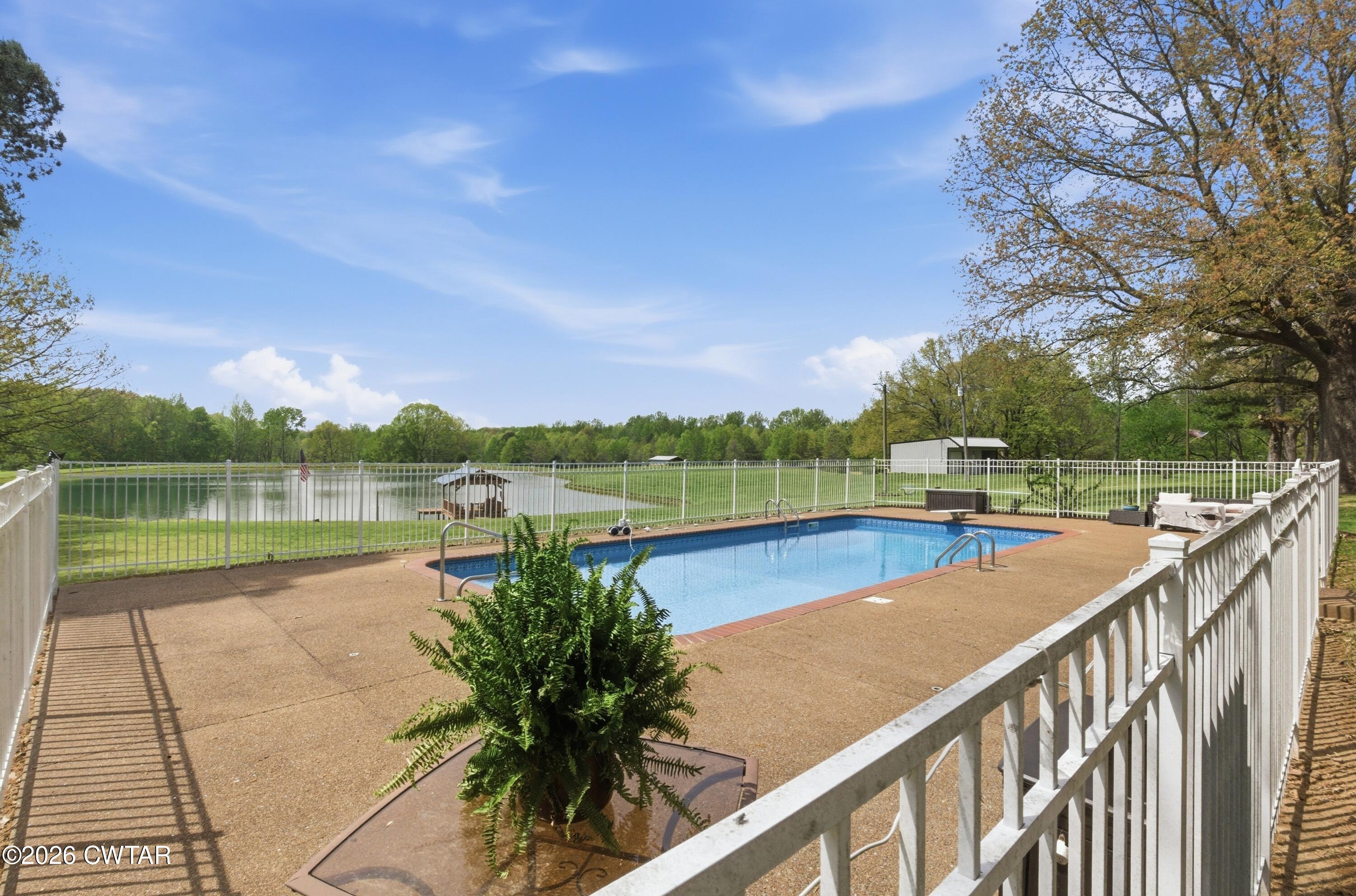 2757 Edward Williams Road Gadsden, TN 38337 - Photo 46 of 51 a view of swimming pool with a lake