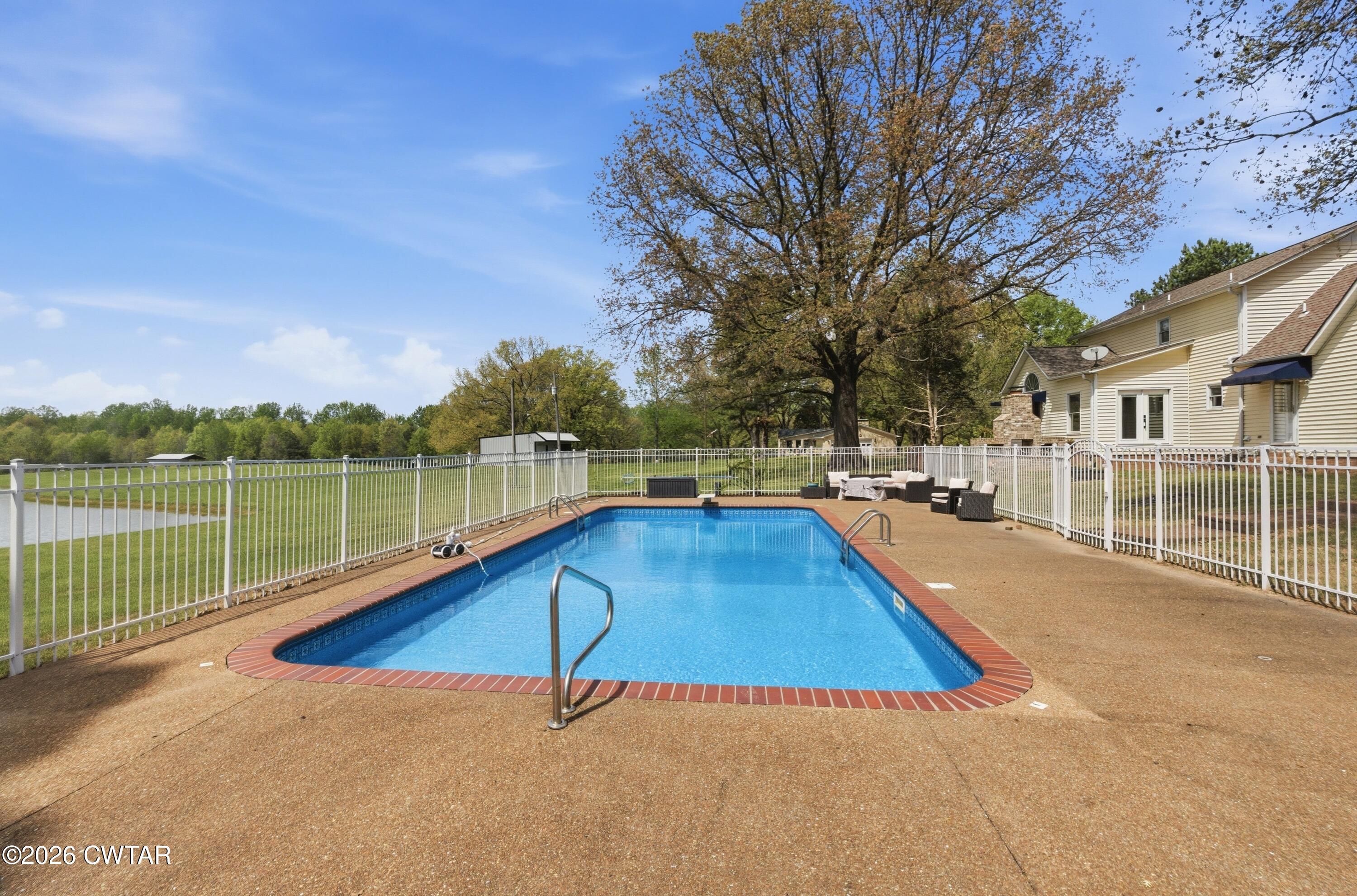 2757 Edward Williams Road Gadsden, TN 38337 - Photo 49 of 51 a view of a house with a swimming pool