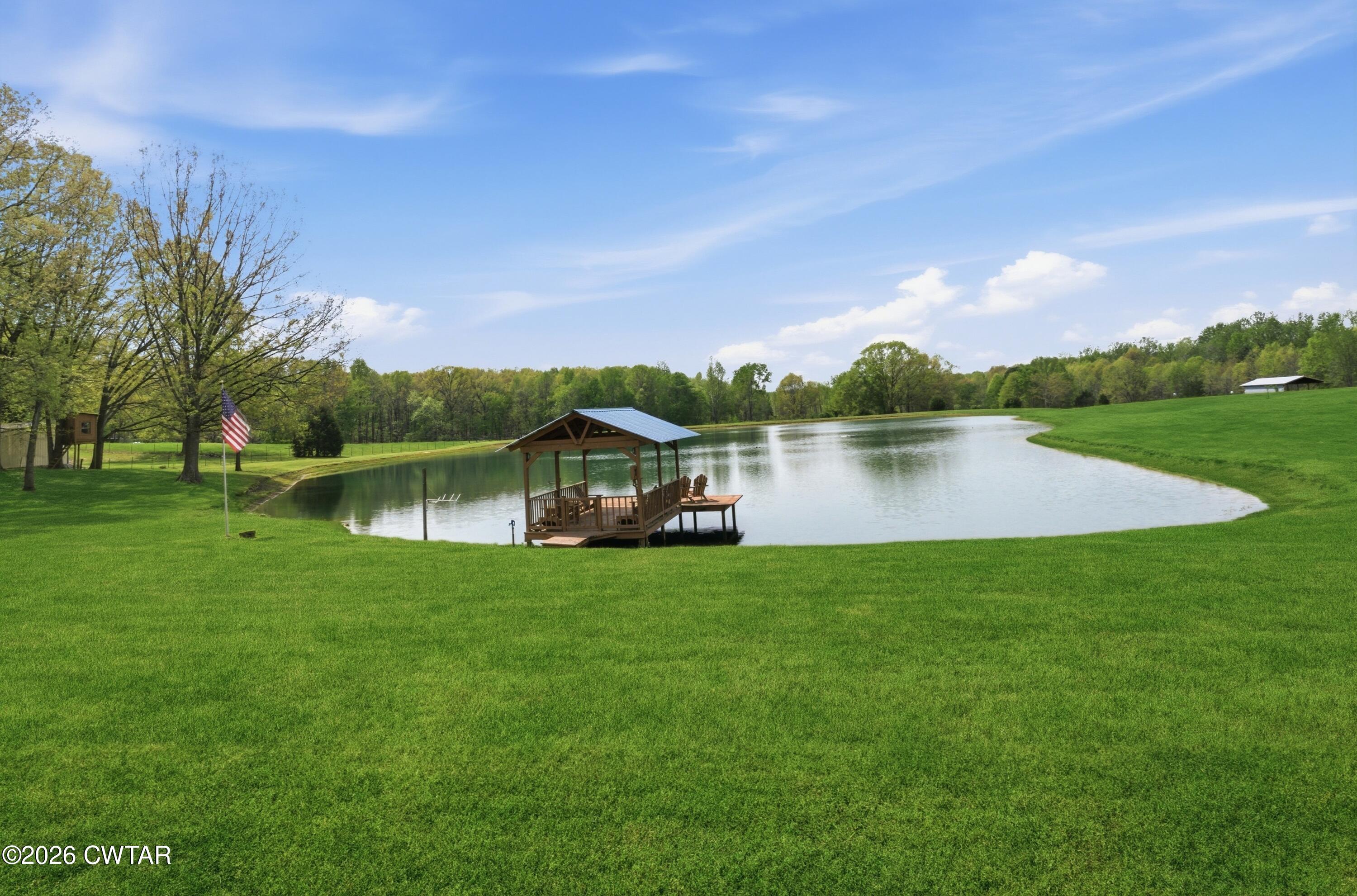 2757 Edward Williams Road Gadsden, TN 38337 - Photo 7 of 51 a view of a house with a yard and a lake view