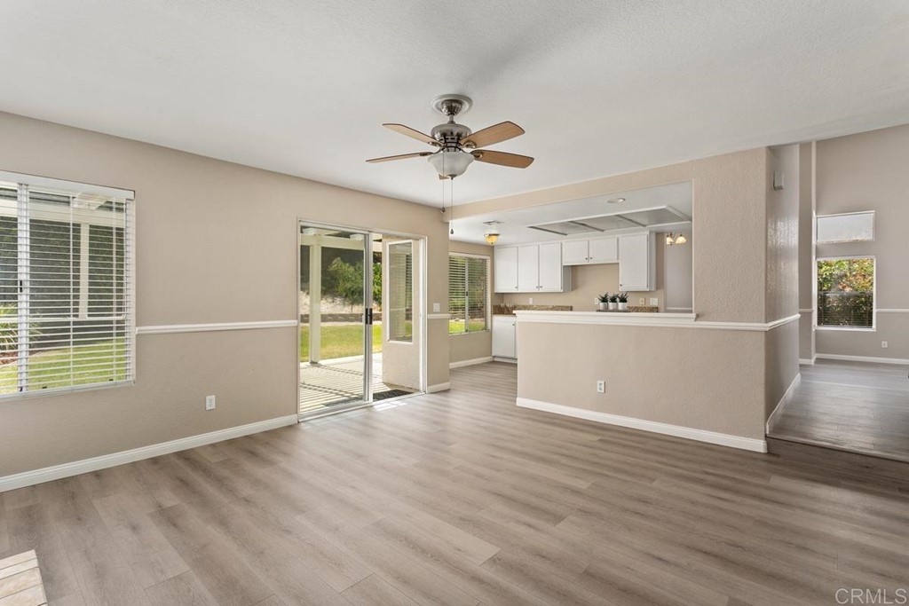 1865 Ithaca Drive Vista, CA 92081 - Photo 20 of 31 a view of a kitchen with a dishwasher cabinets and wooden floor