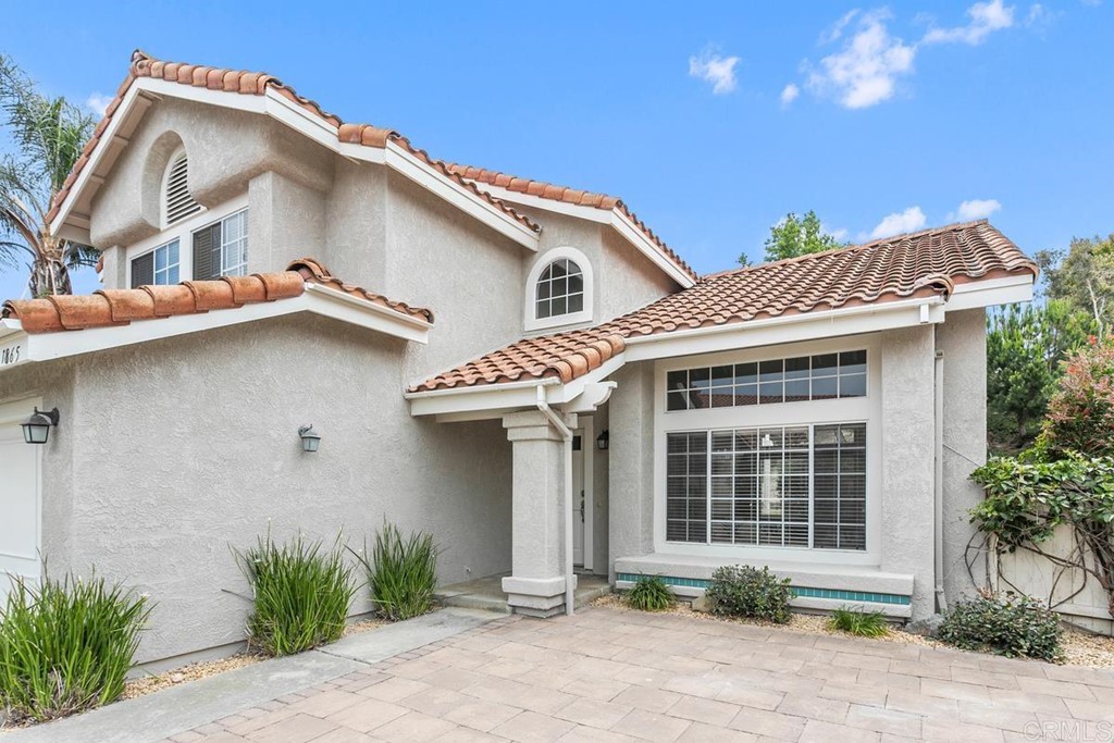 1865 Ithaca Drive Vista, CA 92081 - Photo 2 of 31 a front view of a house with a yard