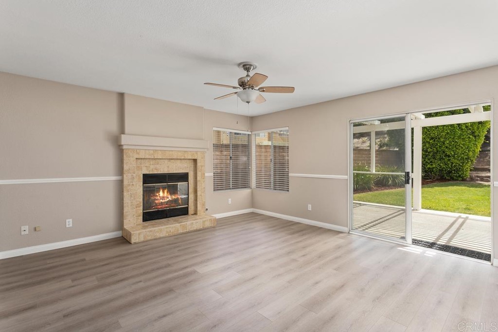 1865 Ithaca Drive Vista, CA 92081 - Photo 21 of 31 a view of an empty room with a fireplace and a window