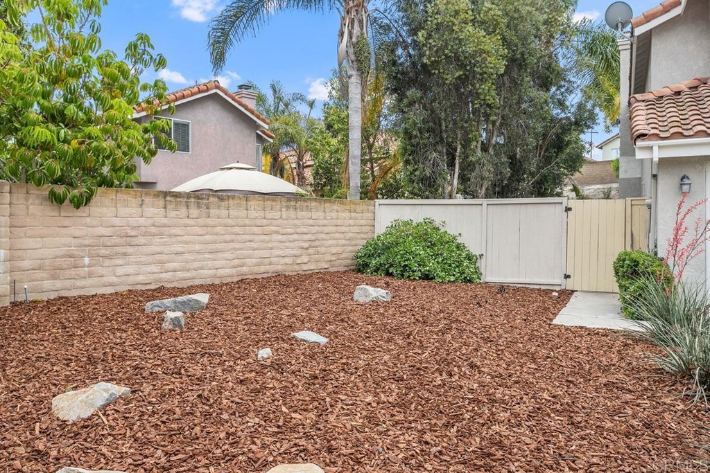 1865 Ithaca Drive Vista, CA 92081 - Photo 29 of 31 a view of a house with a yard and plants