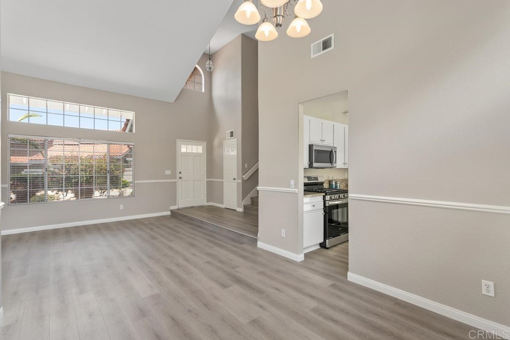 1865 Ithaca Drive Vista, CA 92081 - Photo 10 of 31 a view of a kitchen with wooden floor and a kitchen
