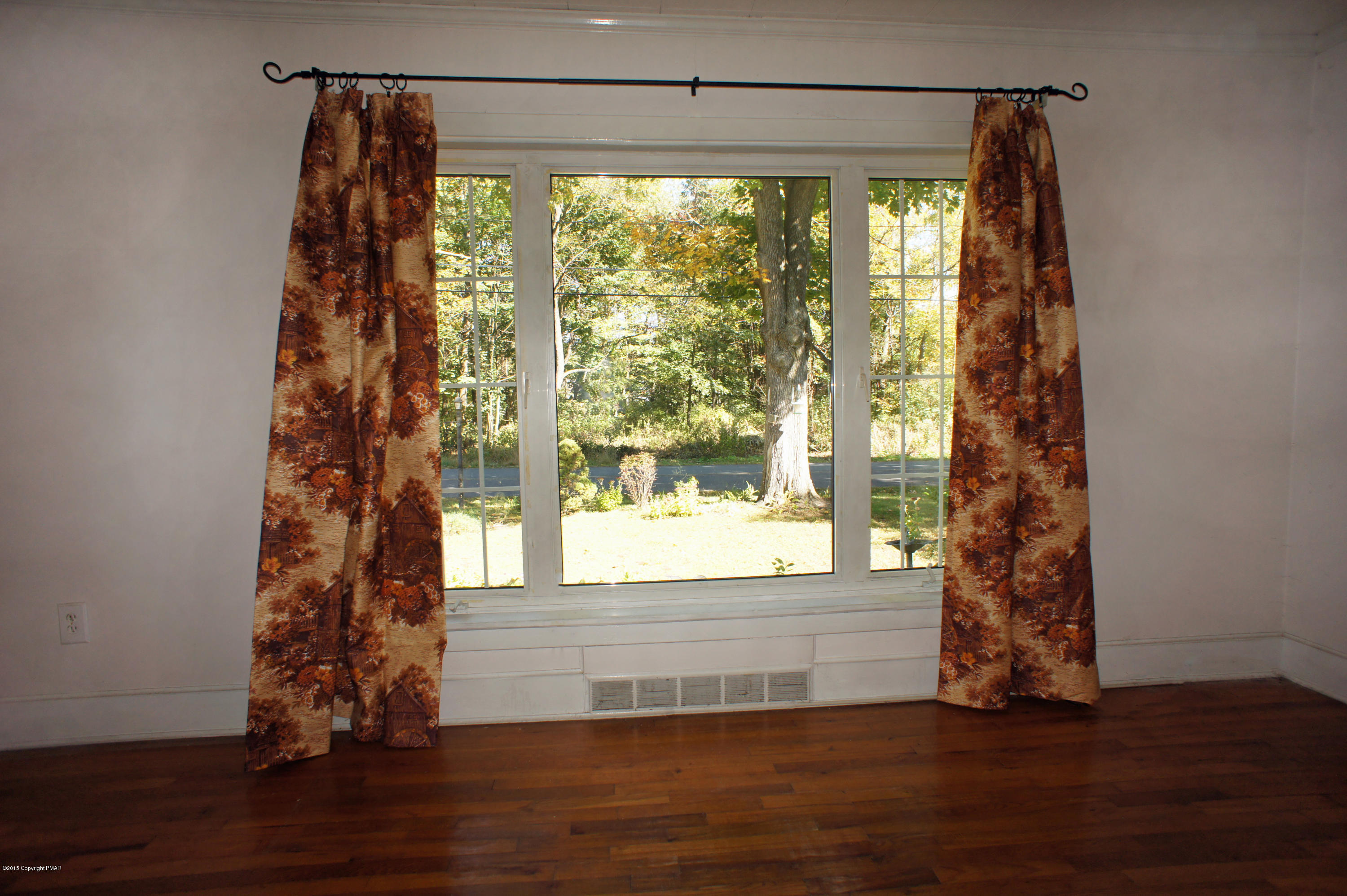 177 Tanite Road Stroudsburg, PA 18360 - Photo 13 of 30 a view of empty room with wooden floor and a window