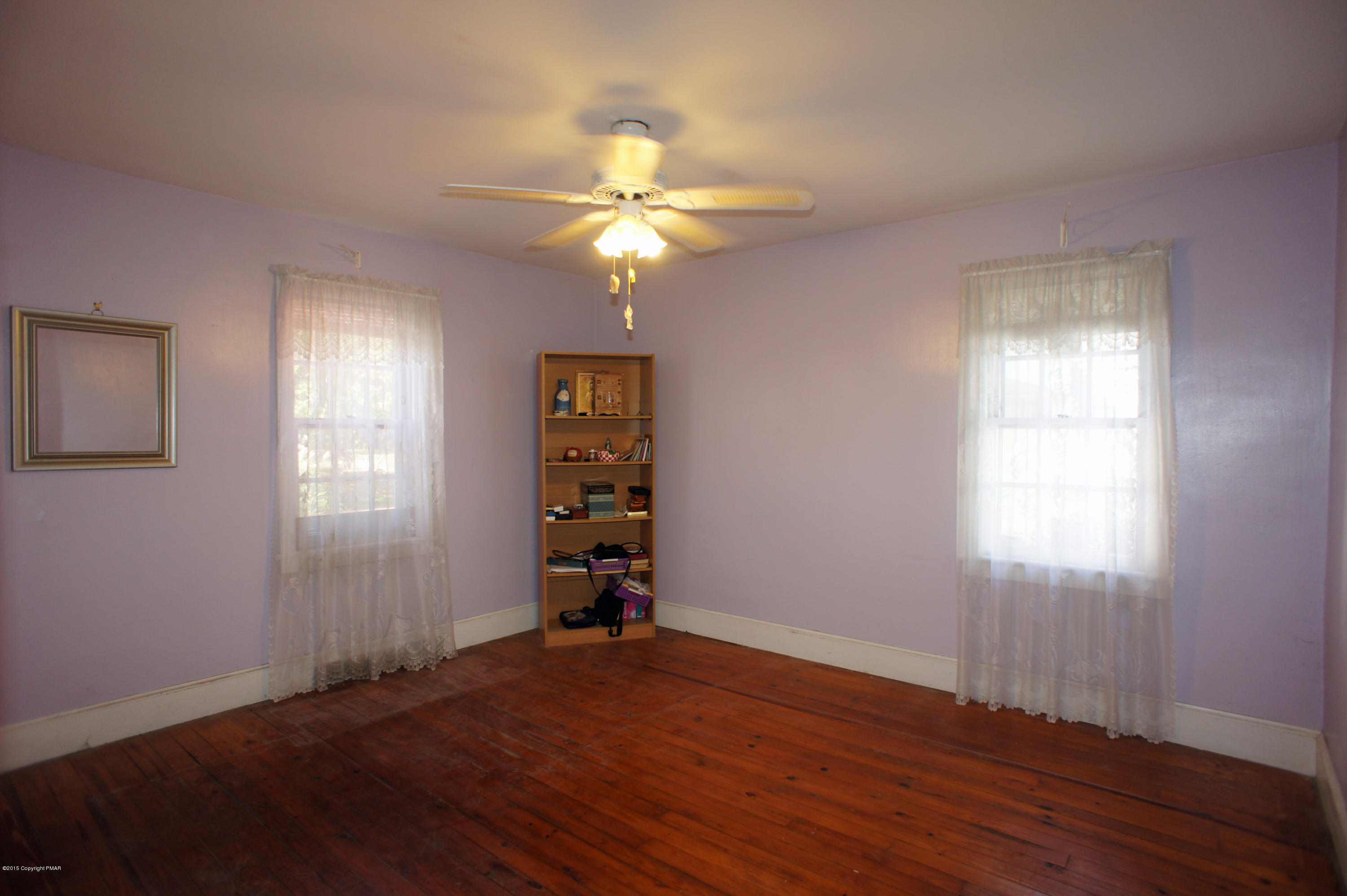 177 Tanite Road Stroudsburg, PA 18360 - Photo 15 of 30 a view of an empty room with window and wooden floor
