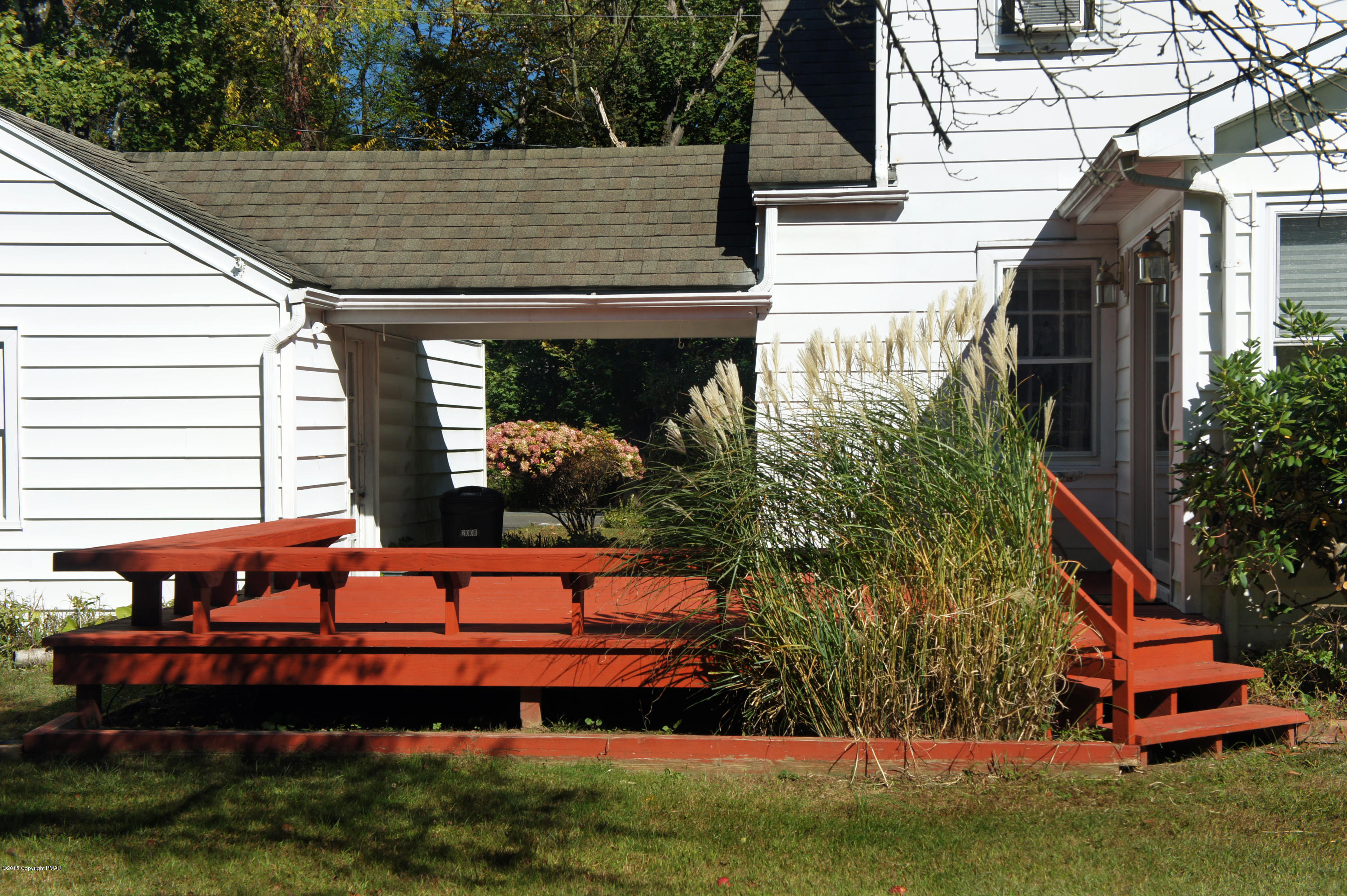 177 Tanite Road Stroudsburg, PA 18360 - Photo 27 of 30 a view of a house with a yard and sitting area