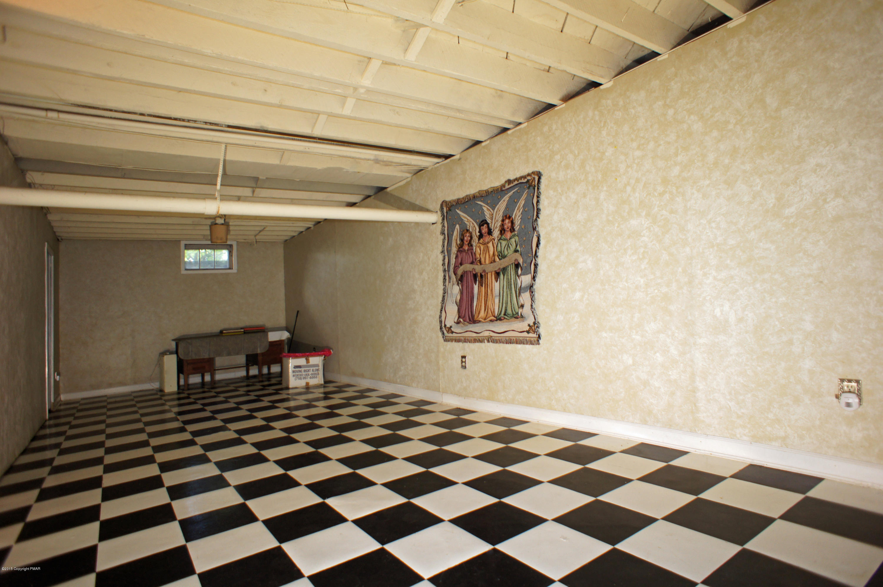177 Tanite Road Stroudsburg, PA 18360 - Photo 29 of 30 a bedroom with a black and white checkered floor