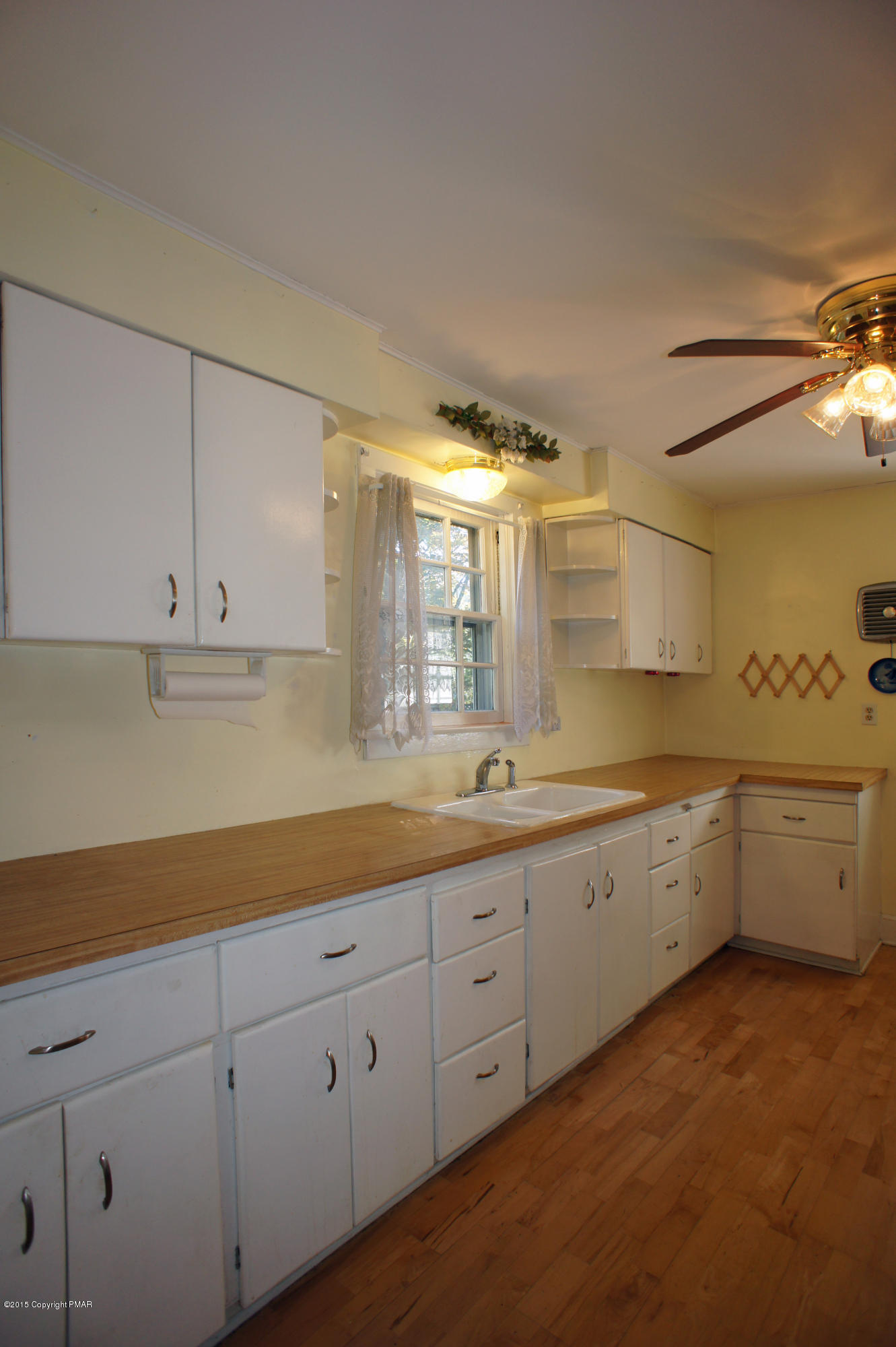 177 Tanite Road Stroudsburg, PA 18360 - Photo 6 of 30 a large white kitchen with a lot of counter space and wooden floor