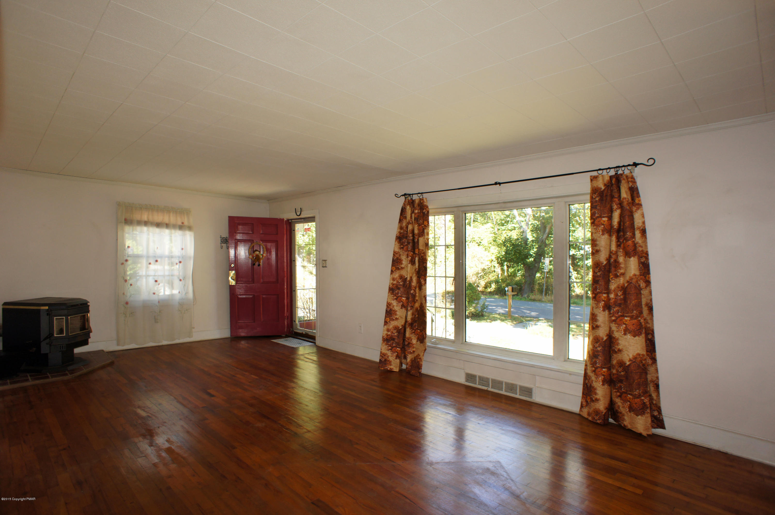 177 Tanite Road Stroudsburg, PA 18360 - Photo 10 of 30 a view of an empty room with wooden floor and a window