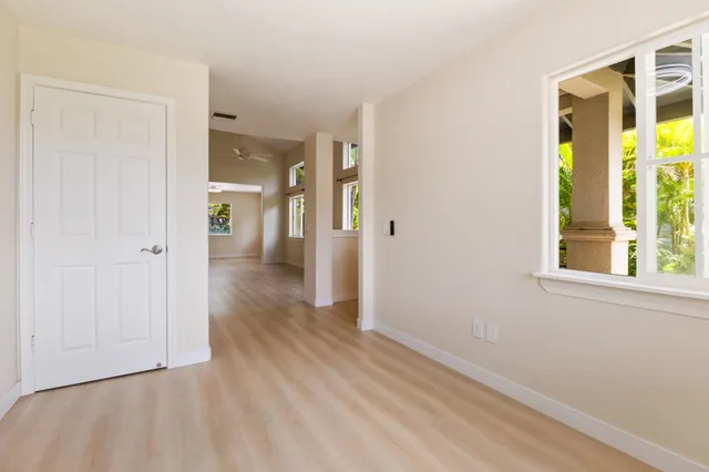 a view of hallway with wooden floor