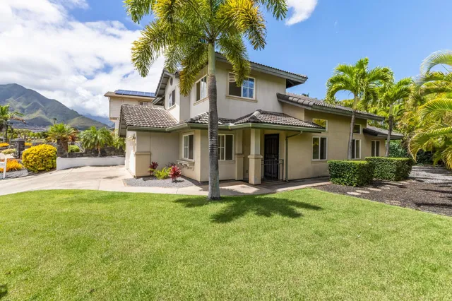 a front view of a house with a garage