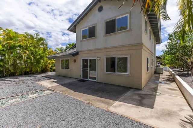 a backyard of a house with lots of green space