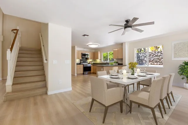 a view of a dining room with furniture and wooden floor
