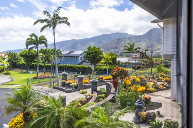 an aerial view of a residential houses with outdoor space