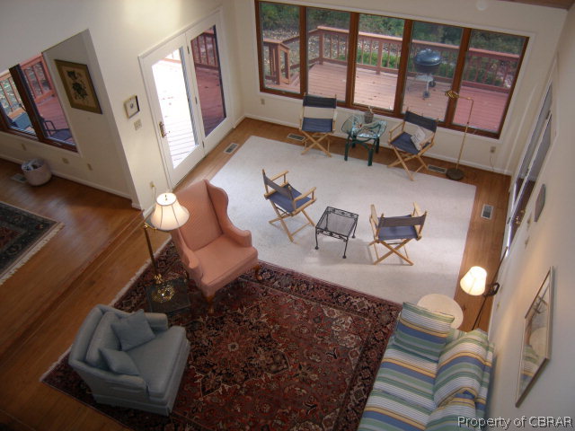 879 West Point Road Lancaster, VA 22503 - Photo 22 of 38 a living room with furniture and a large window