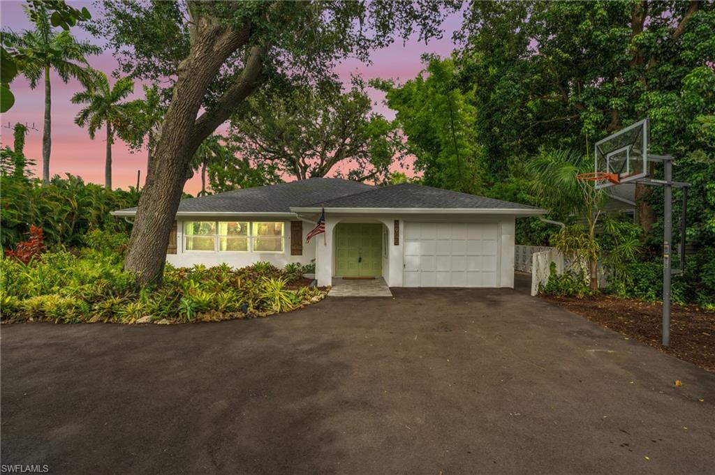 front view of a house with a garden