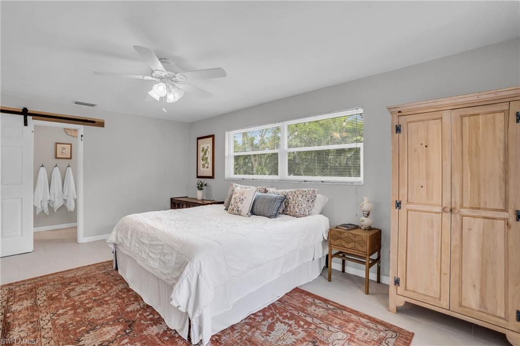 2905 Sunset Road Fort Myers, FL 33901 - Photo 15 of 18 a bedroom with a large bed and a window
