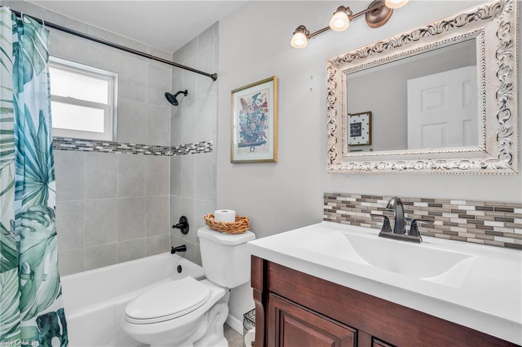 2905 Sunset Road Fort Myers, FL 33901 - Photo 17 of 18 a bathroom with a sink toilet and shower