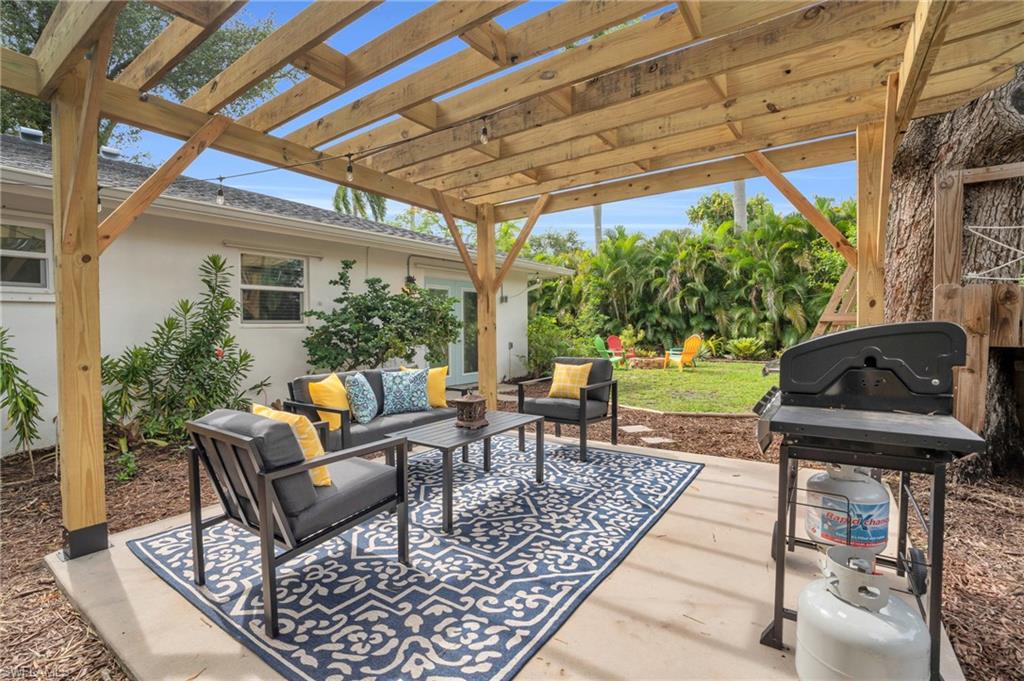 2905 Sunset Road Fort Myers, FL 33901 - Photo 3 of 18 a outdoor living space with furniture and garden view