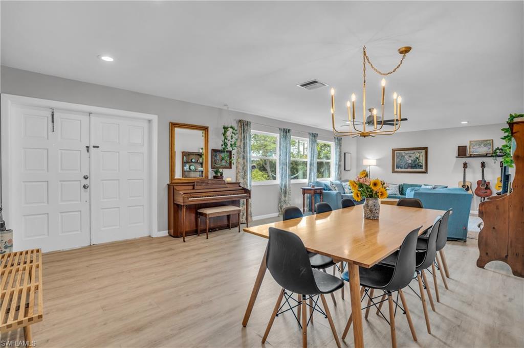 2905 Sunset Road Fort Myers, FL 33901 - Photo 6 of 18 a view of a dining room with furniture window and wooden floor