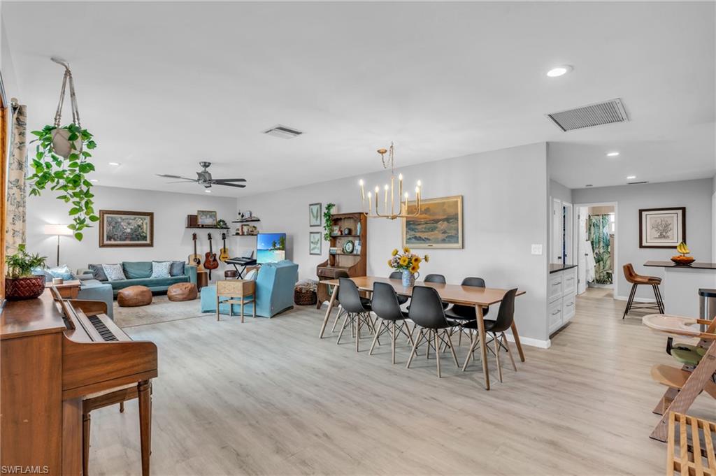 2905 Sunset Road Fort Myers, FL 33901 - Photo 8 of 18 a living room with furniture dining table and a potted plant