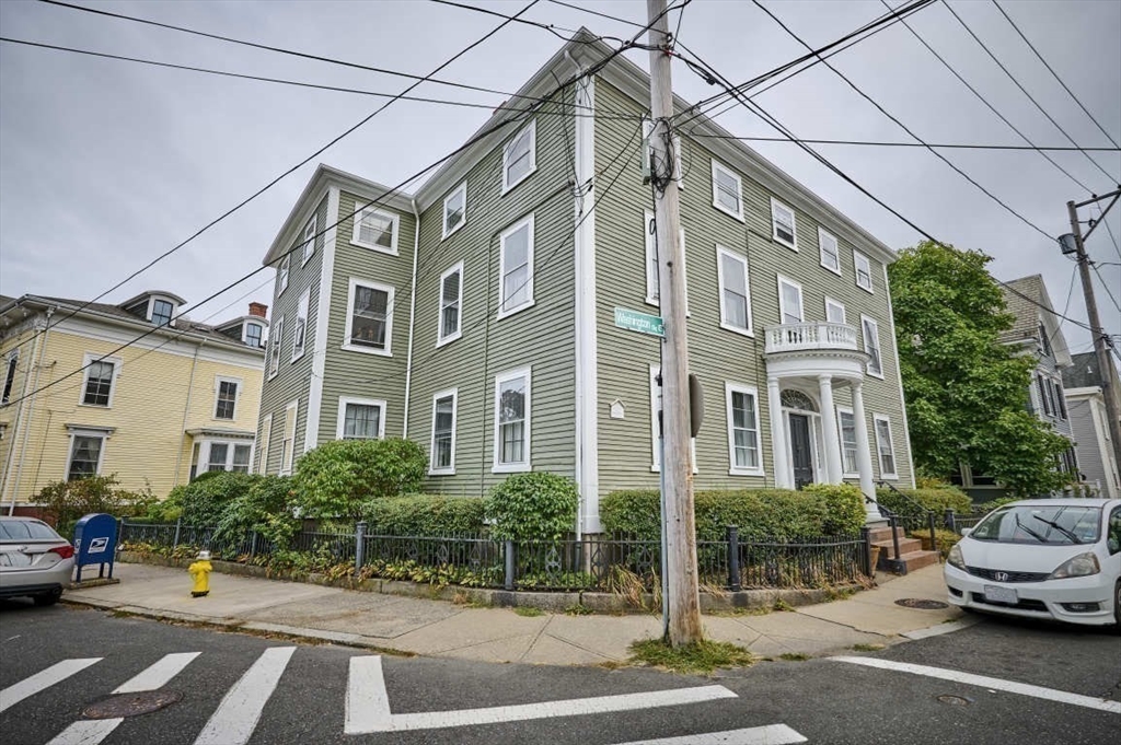 74 Washington Square, Unit 2 Salem, MA 01970 - Photo 24 of 31 a car parked on the side of a street