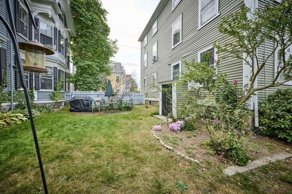 74 Washington Square, Unit 2 Salem, MA 01970 - Photo 25 of 31 a front view of a house with garden