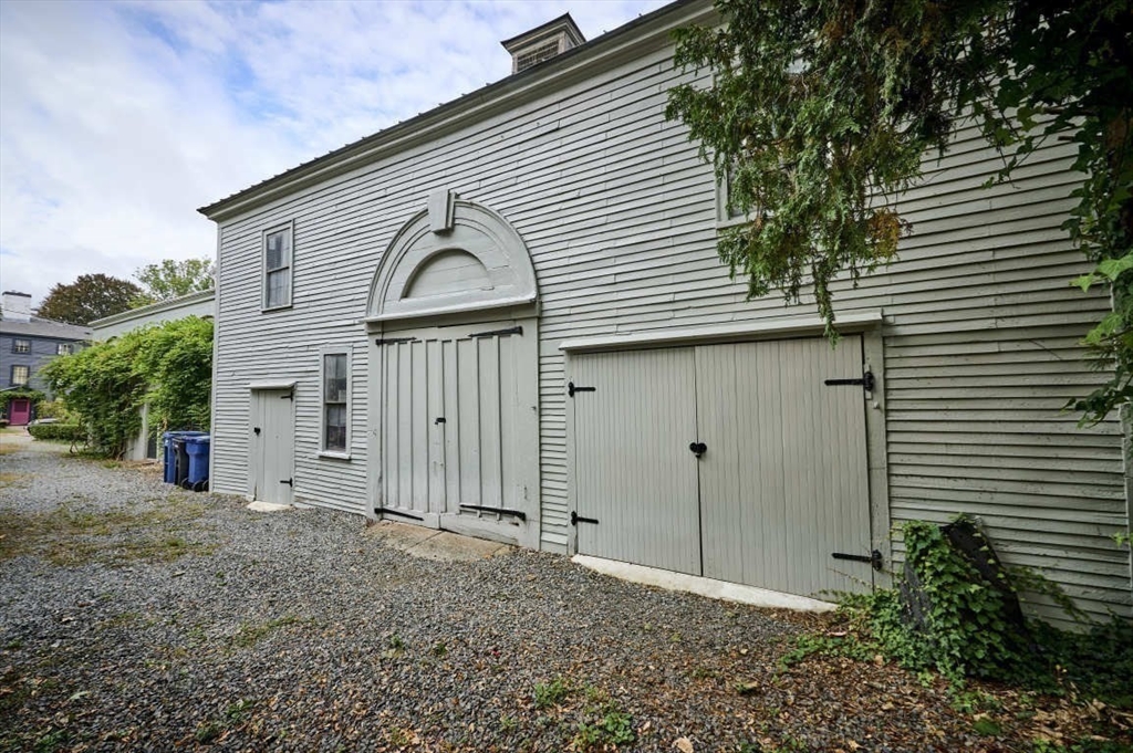 74 Washington Square, Unit 2 Salem, MA 01970 - Photo 27 of 31 a view of a house with a small yard and plants