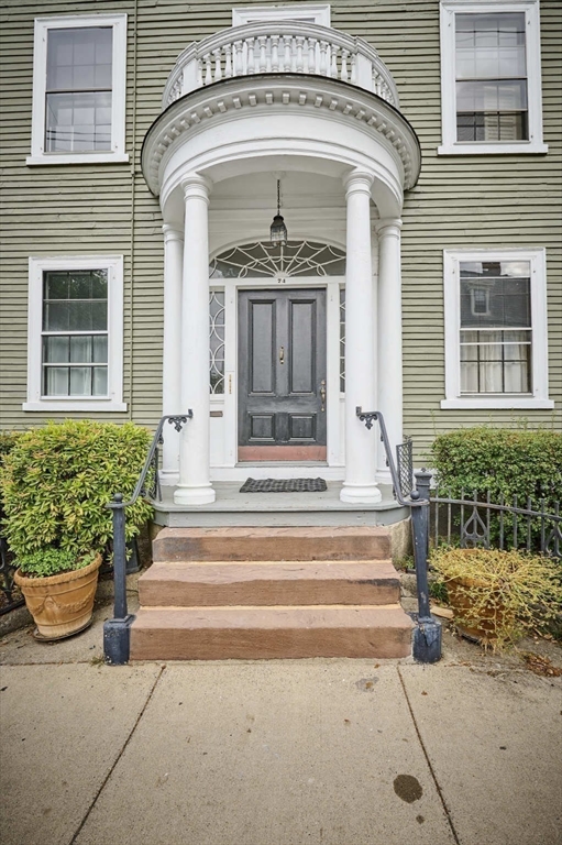 74 Washington Square, Unit 2 Salem, MA 01970 - Photo 28 of 31 a front view of a house with a garden