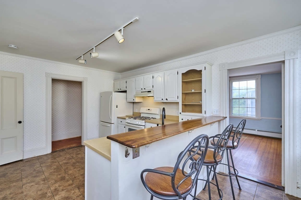 74 Washington Square, Unit 2 Salem, MA 01970 - Photo 4 of 31 a view of a dining room with furniture window and wooden floor