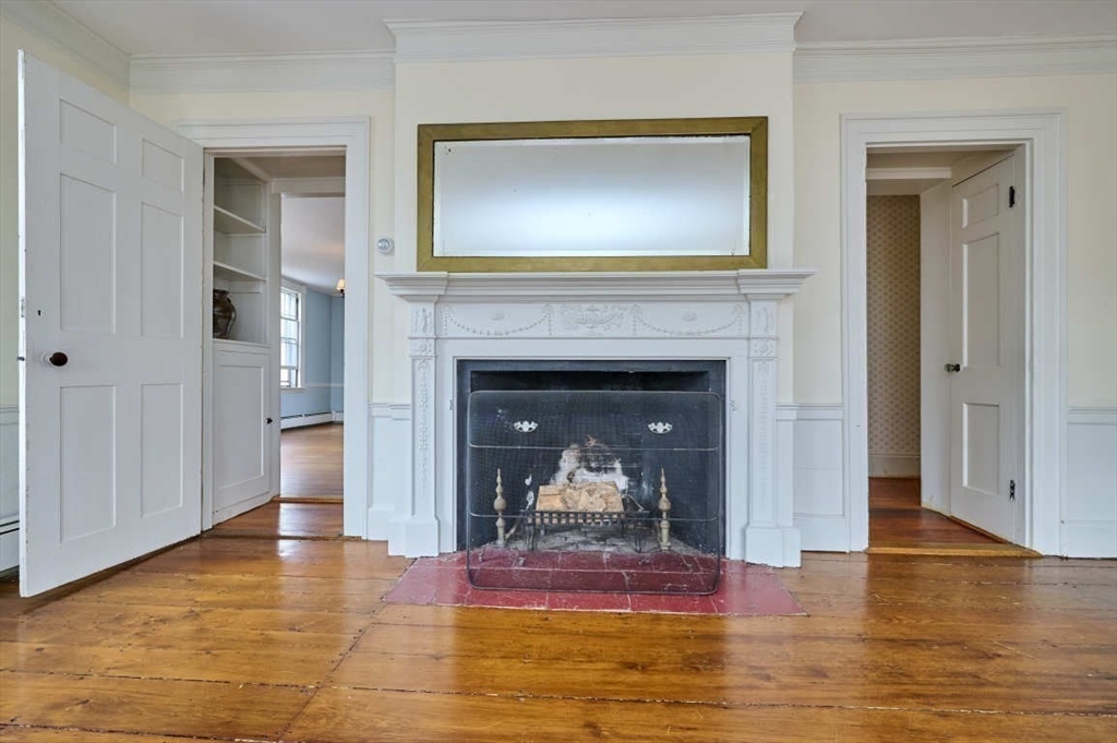 74 Washington Square, Unit 2 Salem, MA 01970 - Photo 6 of 31 a view of a livingroom with a fireplace and window