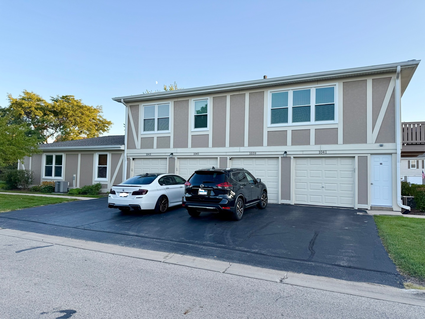 1045 Hampton Harbor, Unit 1045 Schaumburg, IL 60193 - Photo 1 of 18 a car parked in front of a house