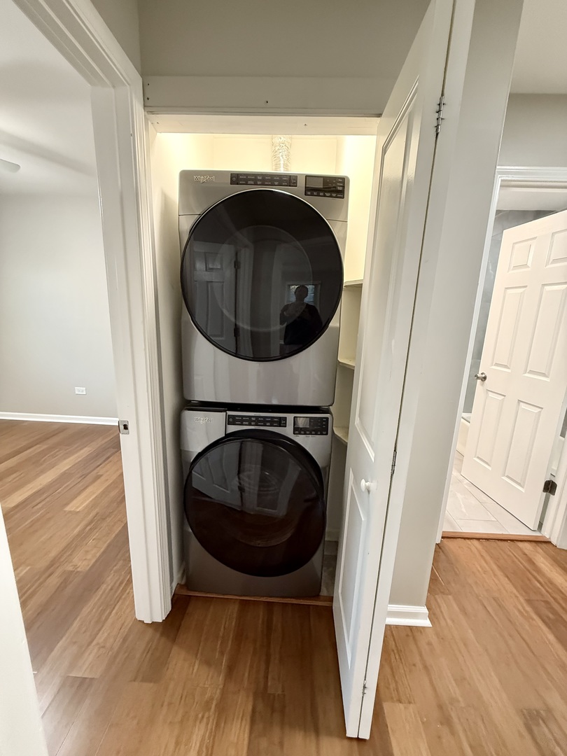 1045 Hampton Harbor, Unit 1045 Schaumburg, IL 60193 - Photo 12 of 18 a view of a hallway with washer and dryer