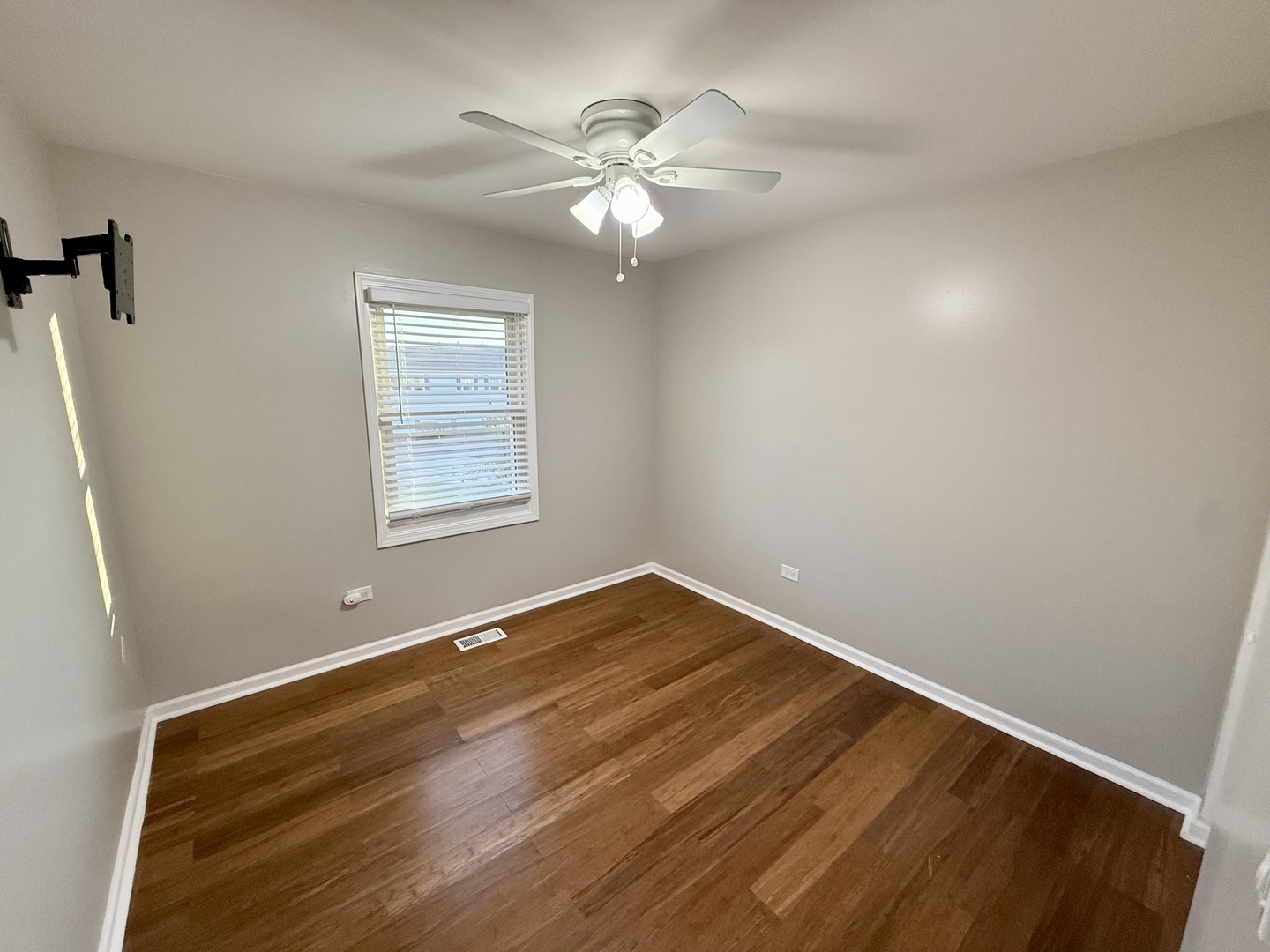 1045 Hampton Harbor, Unit 1045 Schaumburg, IL 60193 - Photo 15 of 18 a view of an empty room with a chandelier fan