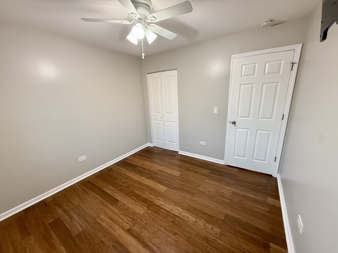 1045 Hampton Harbor, Unit 1045 Schaumburg, IL 60193 - Photo 16 of 18 wooden floor in an empty room
