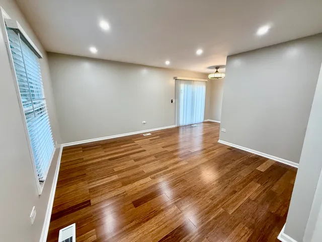 a view of room with wooden floor