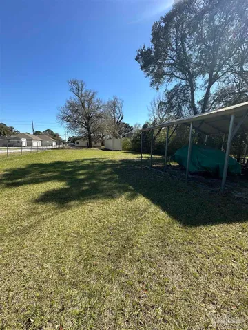 a view of a lake with a yard