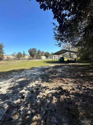 a view of a backyard with trees