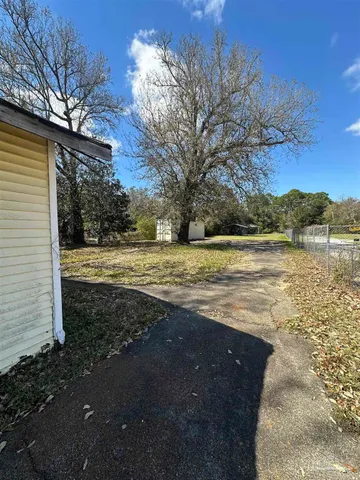 a house view with a backyard space
