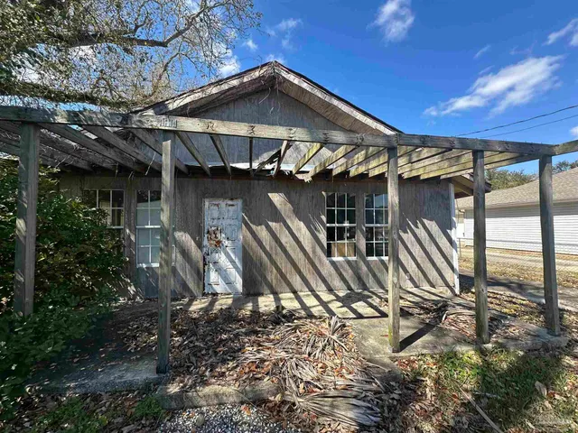 a view of outdoor space with garden and trees