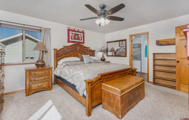 a bedroom with a bed and furniture