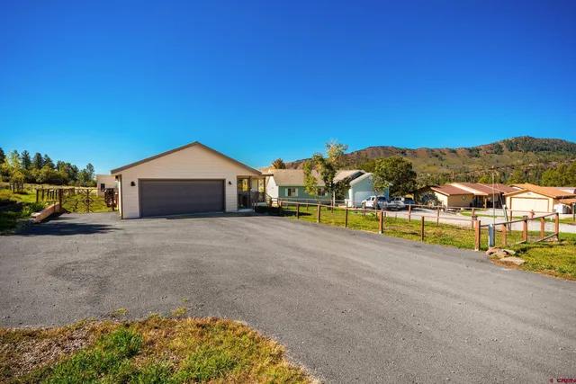 a house with river in front of it